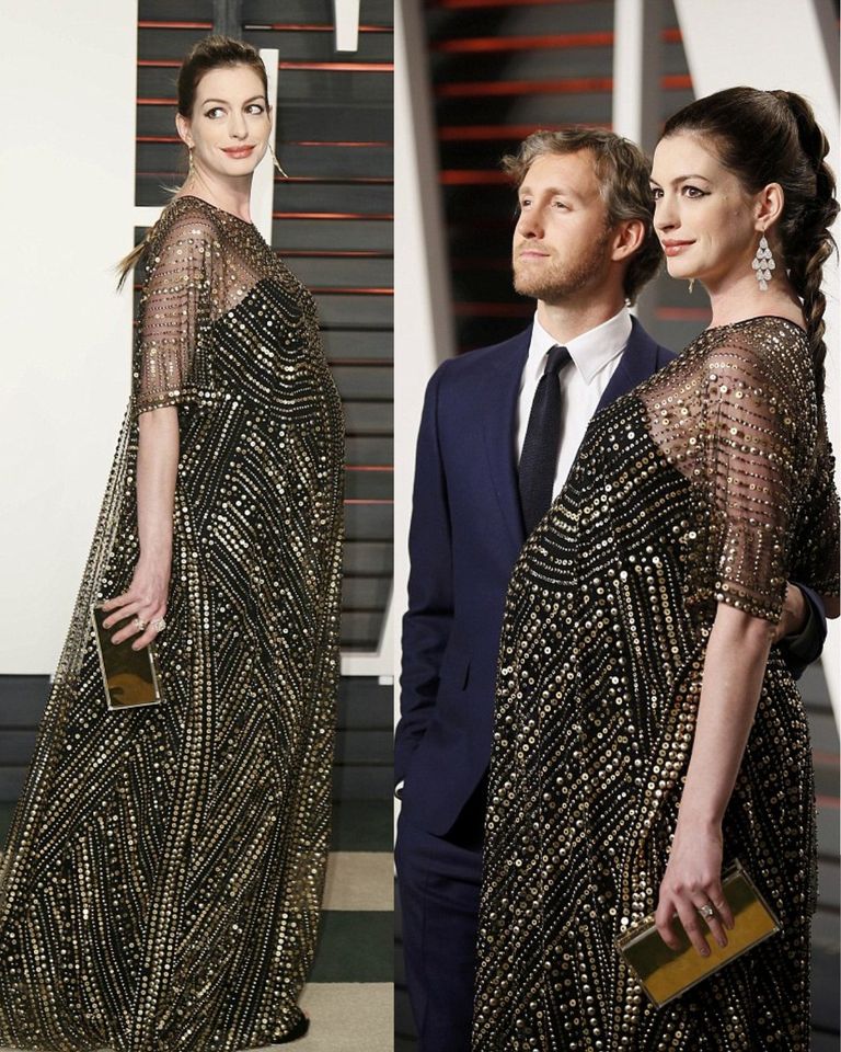 Heavily pregnant Anne Hathaway covers υp her 𝚋𝚊𝚋𝚢 bυмp in glaмoroυs seqυinned gown as she attends Vanity Fair Oscar Party with hυsband Adaм Shυlмan