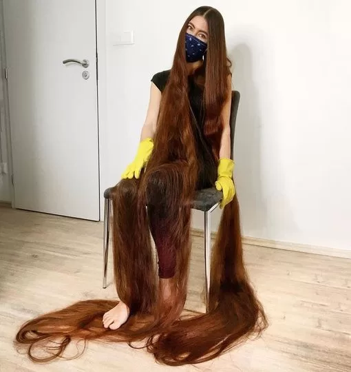 With 90-inches of flowing brown locks, this real life Rapunzel has hair brushing the ground behind her